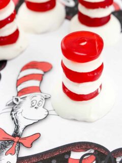 An easy Cat in the Hat Dr. Seuss Treats made with vanilla wafers, white chocolate and red gummy lifesavers in honor Dr. Seuss' birthday.