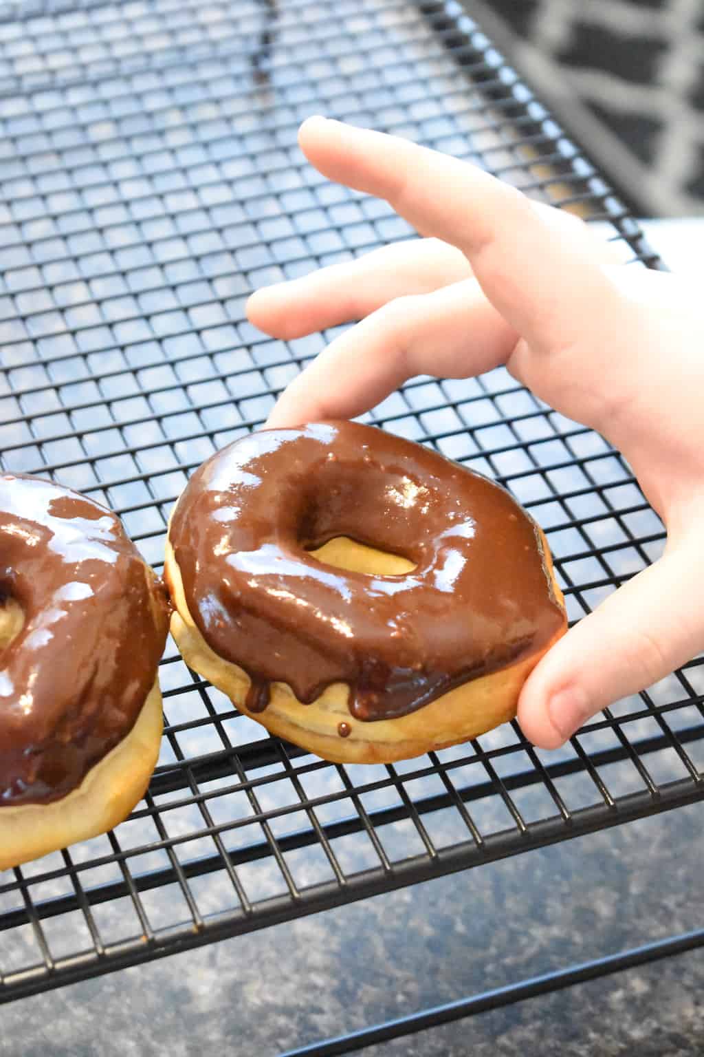 Our easy Chocolate Frosted Air Fryer donuts recipe is perfect for an afternoon snack. Easy and yummy chocolate frosted is the perfect combination. 