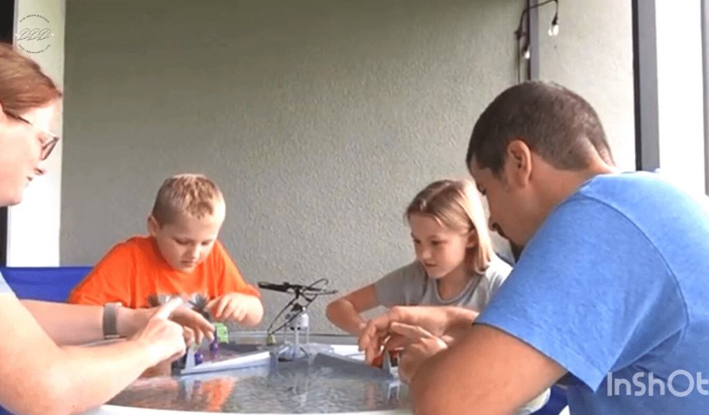 family playing drone home