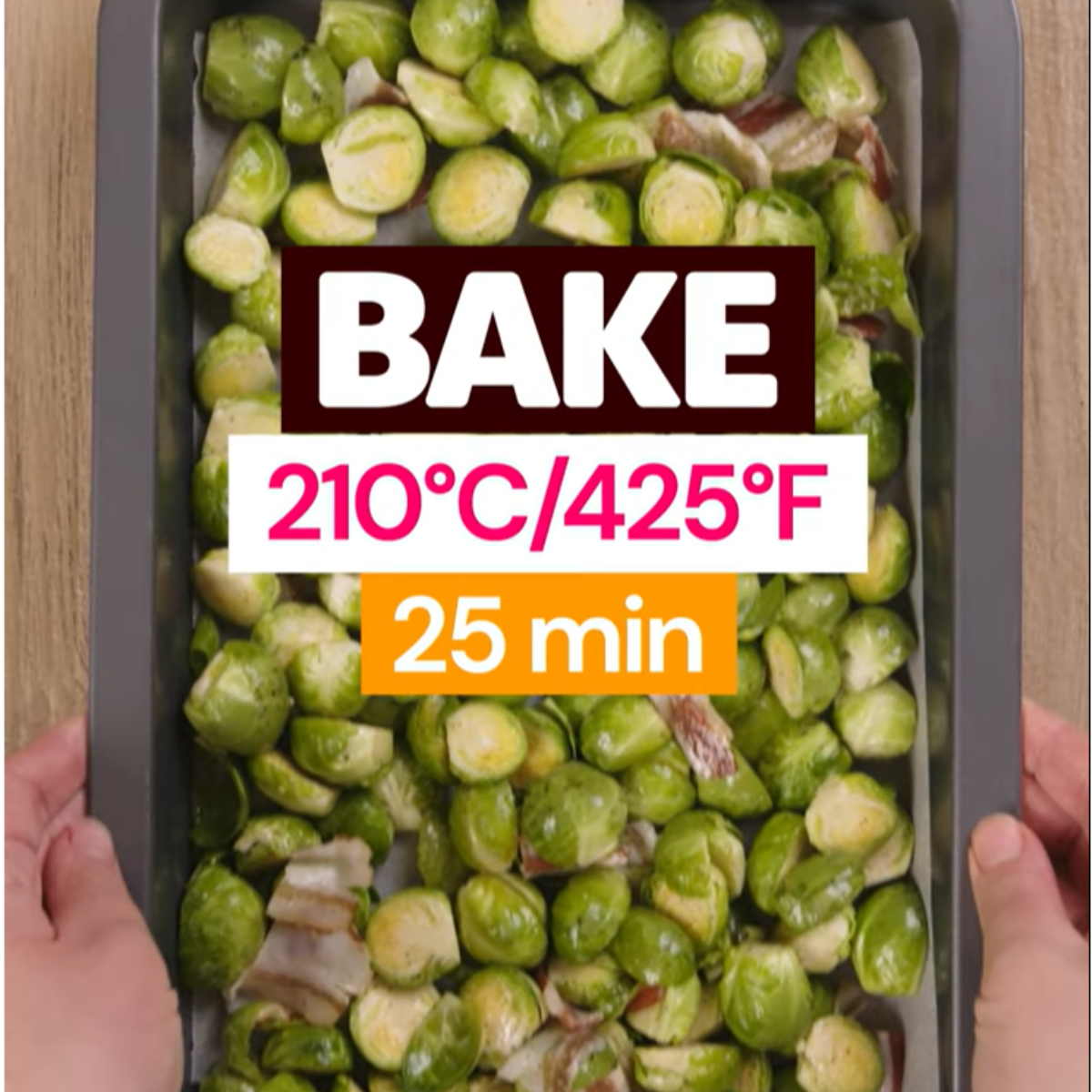 Brussels sprouts and bacon on a baking sheet, ready to bake at 425°F (210°C) for 25 minutes.